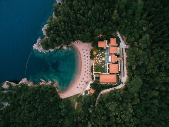 High angle view of buildings by sea