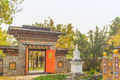 Entrance of temple against building