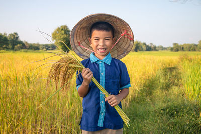 Full length of a boy standing on field