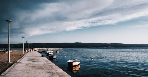 Pier over sea against sky