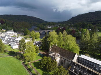 High angle view of trees and buildings against sky