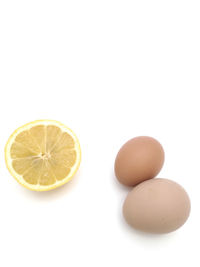 Close-up of eggs against white background