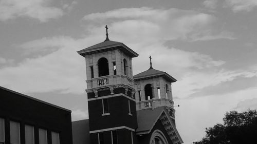 Low angle view of bell tower against sky