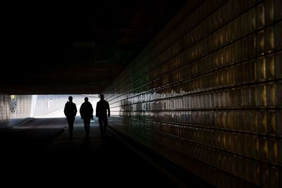 Silhouette people walking in subway