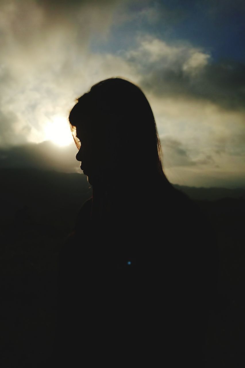 SILHOUETTE OF MAN AGAINST SKY