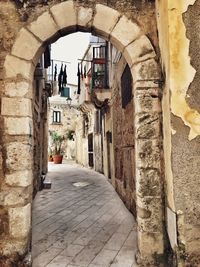 Buildings seen through archway in city