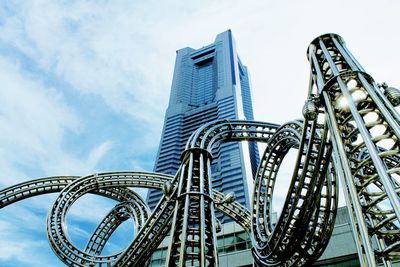 Low angle view of ferris wheel against sky