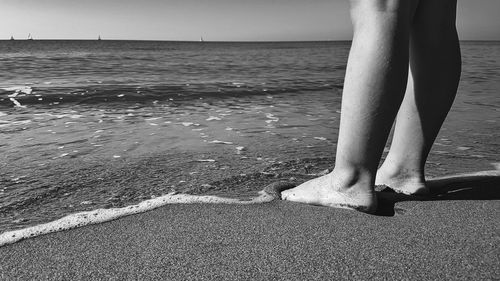 Low section of woman on beach