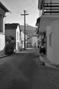 Street amidst buildings in city against sky
