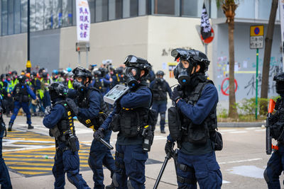 Police force standing on street