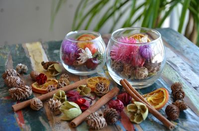 Close-up of dried plants and food on table