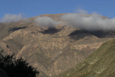 Scenic view of volcanic mountain against sky