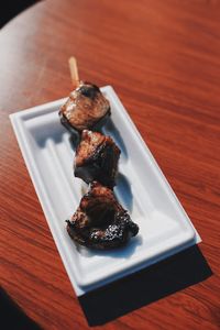 High angle view of meat in plate on table