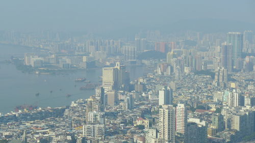 High angle view of modern buildings in city against sky