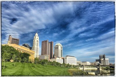 Buildings in city against clear sky