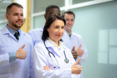 Portrait of doctor examining x-ray at clinic