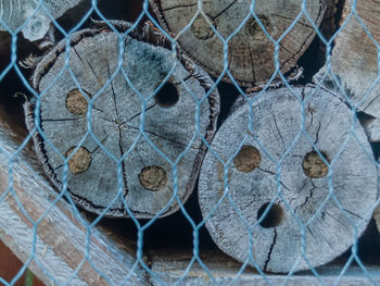 Close-up of logs in fence