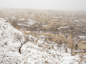 Aerial view of snow covered land