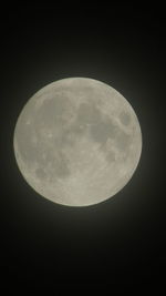 Low angle view of moon against sky at night