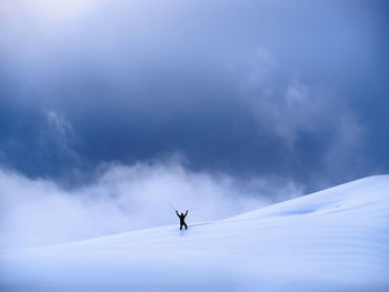 Man on snow against sky