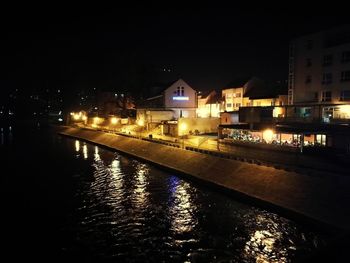 Illuminated buildings in city at night