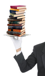 Stack of books against white background