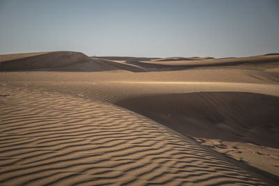 Scenic view of desert against clear sky