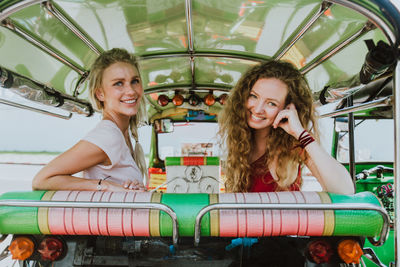 Women sitting in jinrikisha