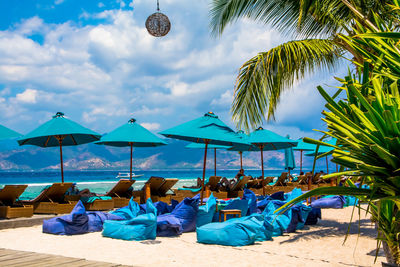 View of beach against cloudy sky