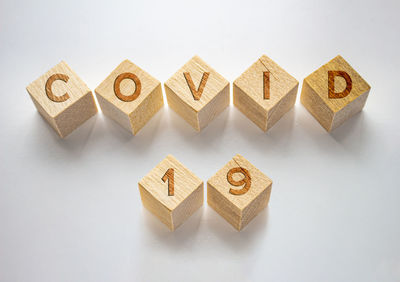 High angle view of toys on table against white background