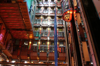 Low angle view of illuminated buildings at night