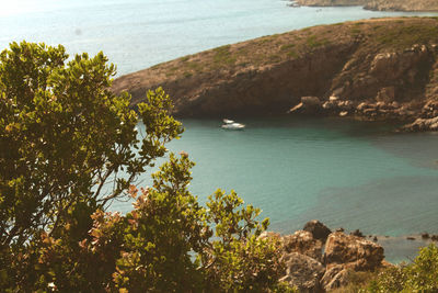 High angle view of rocks on sea