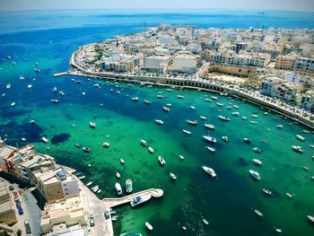 High angle view of sea and buildings in city