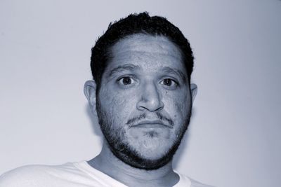 Portrait of bearded man against white background