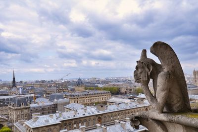 Gargoyle of notre dame cathedral is located at the roof top of the cathedral  