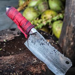 Close-up of knife on tree stump