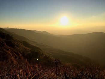Scenic view of mountains against sky during sunset