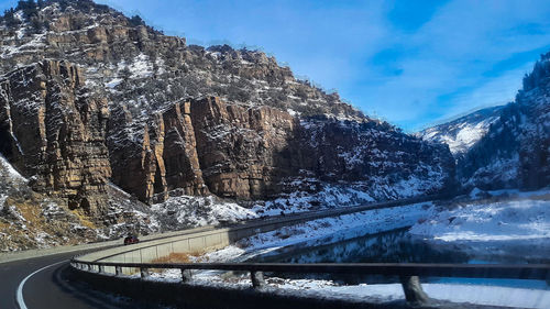 Panoramic view of snowcapped mountain against sky during winter