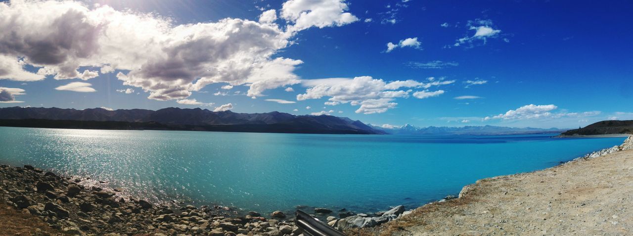 water, sea, blue, sky, tranquil scene, scenics, tranquility, beauty in nature, nature, beach, cloud - sky, shore, mountain, cloud, idyllic, coastline, rock - object, day, horizon over water, outdoors