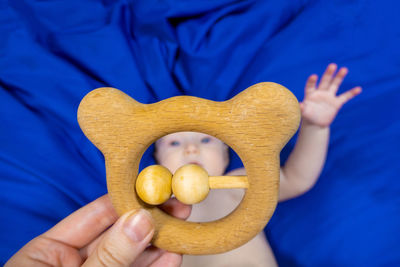 Cropped hand of person holding toy