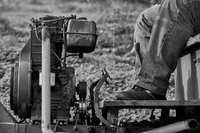 Low section of man working on machinery