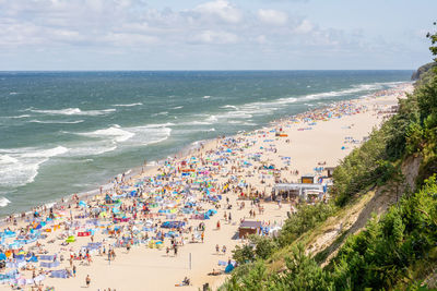 High angle view of people on beach against sky