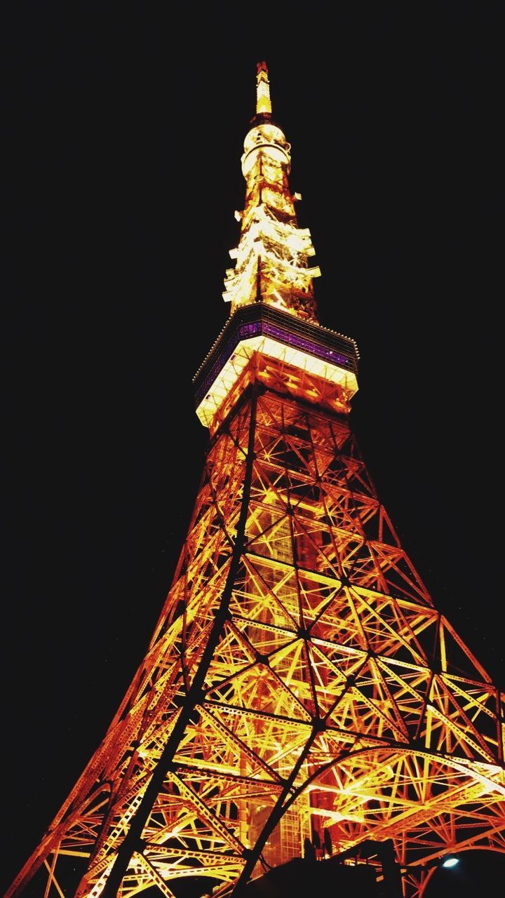 LOW ANGLE VIEW OF BUILDING AGAINST SKY AT NIGHT