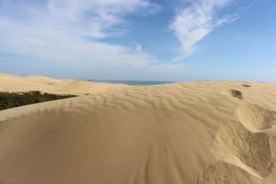 Scenic view of desert against sky