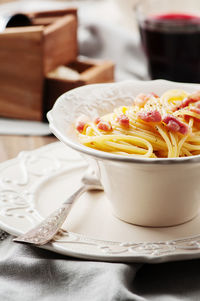 Close-up of noodles in bowl on table