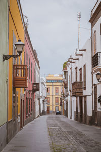 Las palmas, spain, 31st march 2022 - street with buildings and people during a sunny day