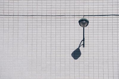 High angle view of clock on tiled floor