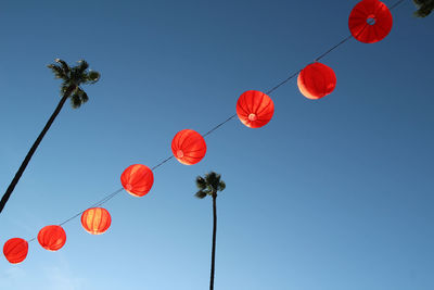 Low angle view of balloons against clear sky