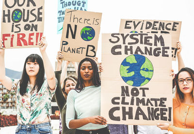 Young women holding sign while protesting 