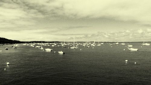 High angle view of boats in sea against sky